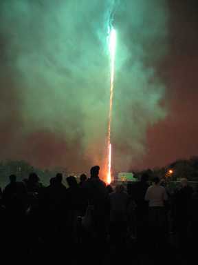 A crowd watches the fireworks