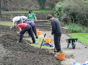 Volunteers revitalising park flowerbed