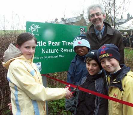 Cutting the ribbon at Little Pear Tree Field