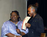 Aisha Hill receiving her award