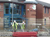 Workers outside The ACE Centre on The Wicker,  after the flood, 10:10am. 
