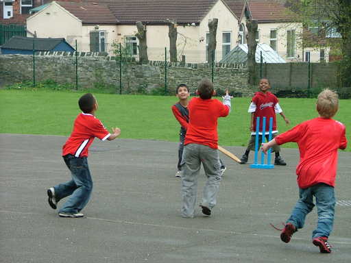 Children spend the afternoon playing cricket