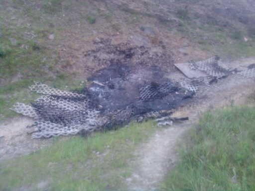 Matting burnt on the public footpath