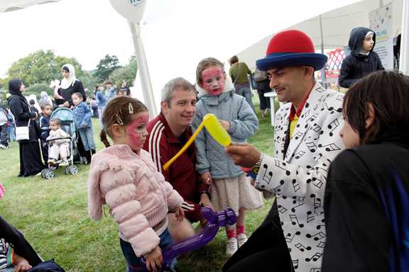 A man making balloon animals