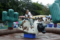A resident tries out the bucking bronco