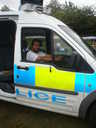 A man tries out the police van