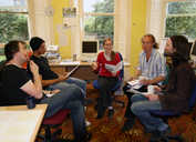 Volunteers meet as the editorial team to discuss possible stories