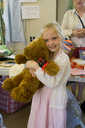 Girl wins teddy bear.