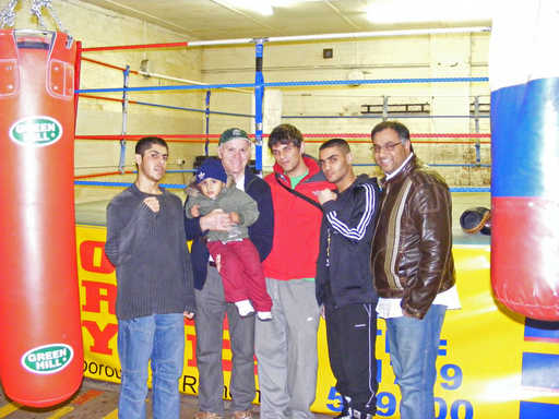 Brendan Ingle, with baby Gabriel, Moshin Khan (second from the right), Hafeas Rehman (right) talk to the Messenger’s Brent Moya (centre).