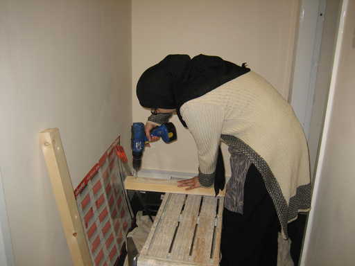 Woman  using power drill