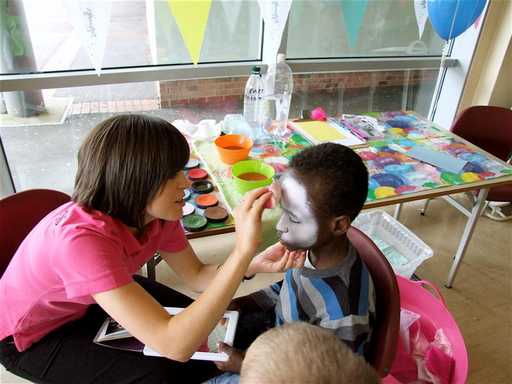 Boy having face painted