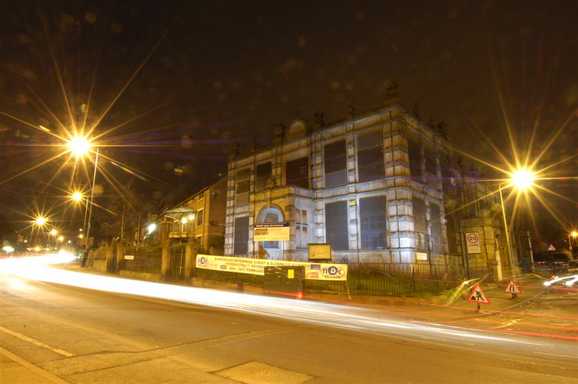 Vestry Hall at  night boarded up 