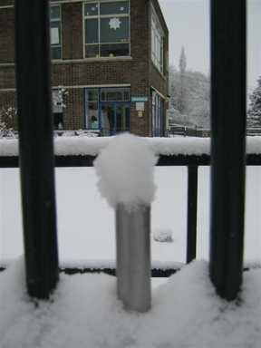 A little pile of snow on the school gates