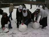 Children at Reach High 2 Study Support rolling snowballs