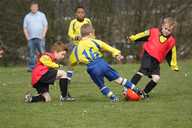 The Under 8s mid-tackle