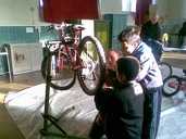 Boys put what they've learnt about bike repair into practice