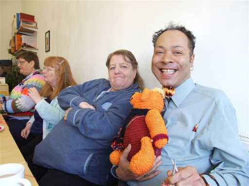 Darren with the teddy bear he knitted