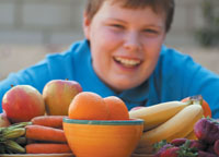 Boy and a bowl of fruit