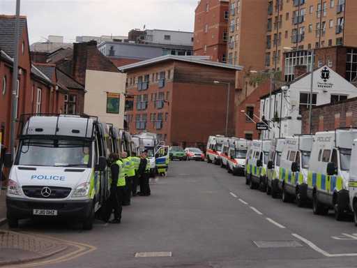 Police vehicles lining the street
