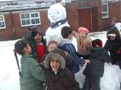 Kids build a snowman