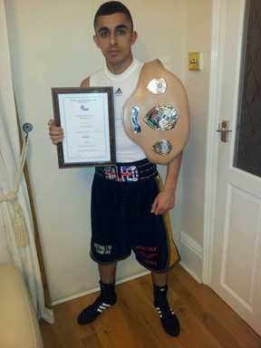 Waleed Din with his boxing prize belt