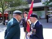 Normandy Veterans Chairman, Ken Riley, with the NVA flag